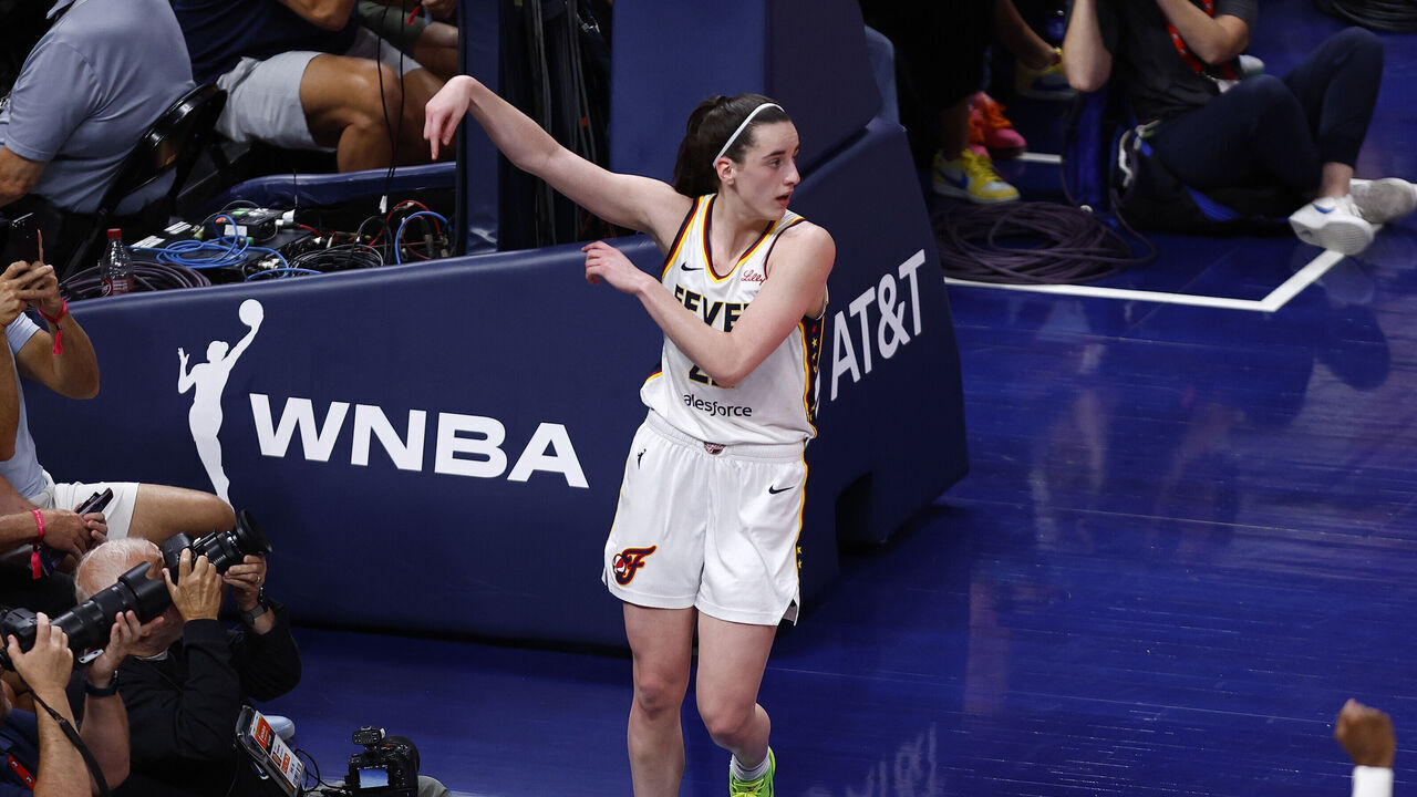 INDIANAPOLIS, IN - JULY 12: Indiana Fever guard Caitlin Clark (22) signals a and one after being fouled in the second quarter of play during a WNBA game between the Phoenix Mercury and the Indiana Fever on July 12, 2024 at Gainbridge Fieldhouse in Indianapolis, IN.