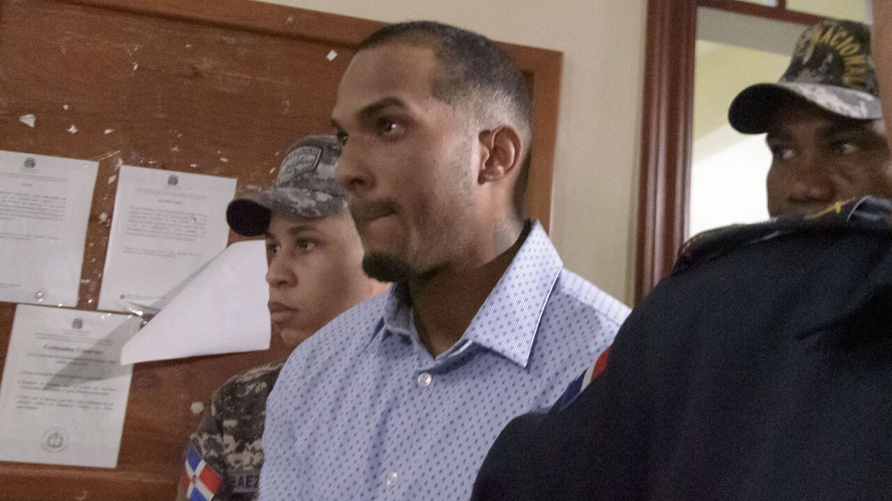 Tampa Bay Rays Dominican baseball shortstop Wander Franco, who faces an accusation of molesting an underage girl, leaves court under heavy escort in Puerto Plata, Dominican Republic, on January 5, 2024. The hearing was being held behind closed doors and Franco, 22, who is eligible for the Major League Baseball All-Star Game in the 2023 season, did not make a statement before entering. The baseball player and the mother of the 15-year-old girl were charged with "the crimes of commercial sexual exploitation and money laundering."