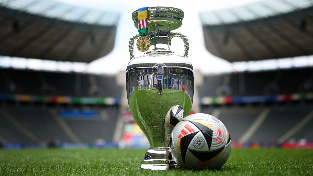 BERLIN, GERMANY - JULY 13: A view of the UEFA EURO trophy, winners medal and match ball ahead of the UEFA EURO 2024 Final between Spain and England at Olympiastadion Berlin on July 13, 2024 in Berlin, Germany.