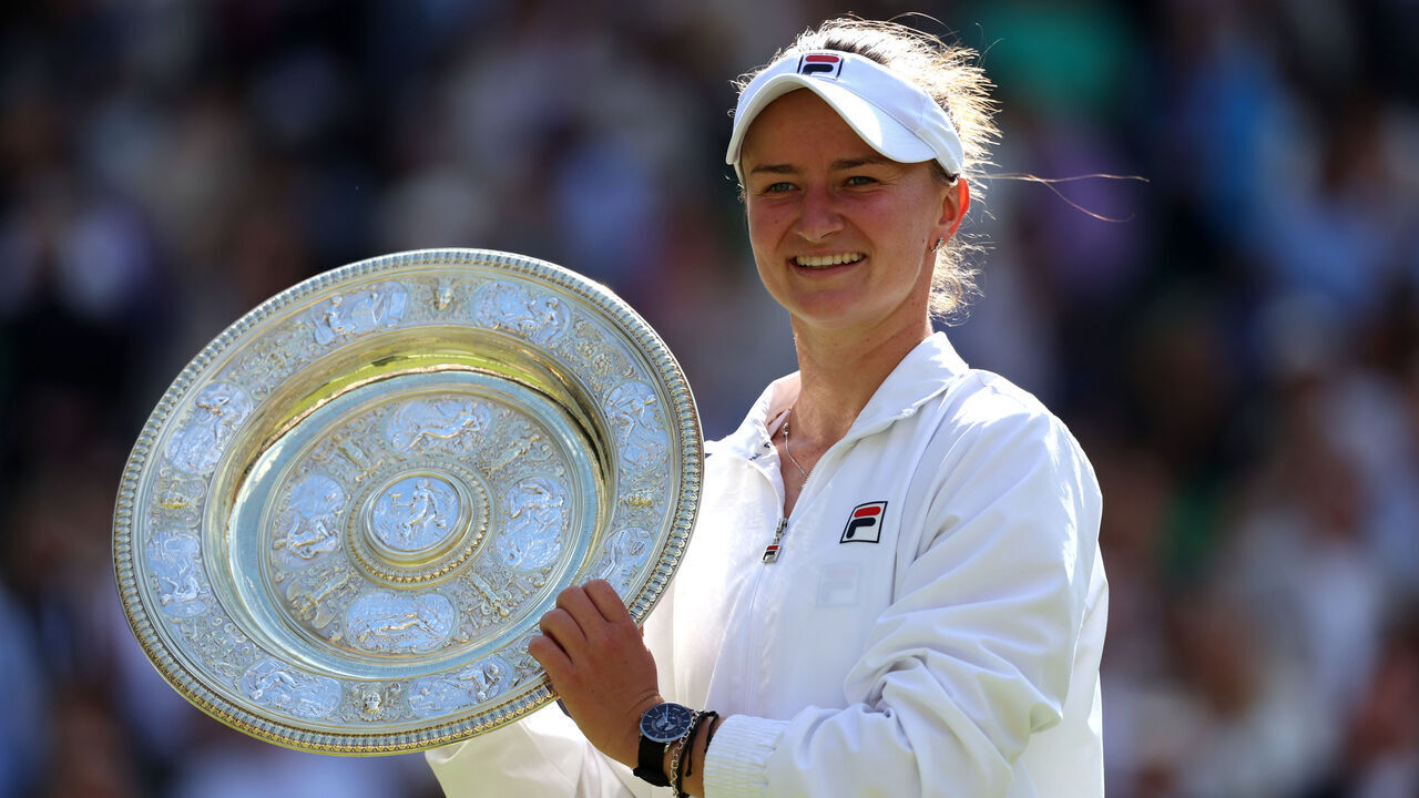 LONDON, ENGLAND - JULY 13: Barbora Krejcikova of Czechia poses with the Ladies' Singles Trophy following victory against Jasmine Paolini of Italy during her Ladies' Singles Final match during day thirteen of The Championships Wimbledon 2024 at All England Lawn Tennis and Croquet Club on July 13, 2024 in London, England.
