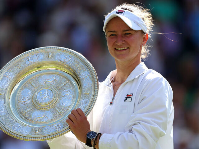 LONDON, ENGLAND - JULY 13: Barbora Krejcikova of Czechia poses with the Ladies' Singles Trophy following victory against Jasmine Paolini of Italy during her Ladies' Singles Final match during day thirteen of The Championships Wimbledon 2024 at All England Lawn Tennis and Croquet Club on July 13, 2024 in London, England.