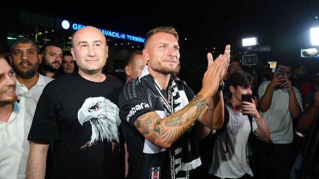 ISTANBUL, TURKIYE - JULY 13: Italian footballer Ciro Immobile, with whom Besiktas started transfer negotiations, greets Besiktas fans as he arrives at Atatürk Airport General Aviation Terminal with the second president of Besiktas Huseyin Yucel (L) and board member Feyyaz Ucar in Istanbul, Turkiye on July 13, 2024. Ciro Immobile landed with a private plane in Istanbul this evening to complete his transfer from Lazio to Besiktas.