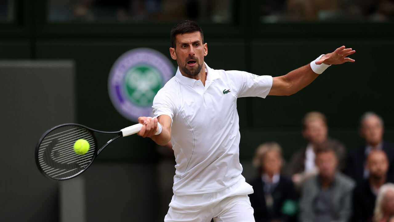LONDON, ENGLAND - JULY 12: Novak Djokovic of Serbia plays a forehand against Lorenzo Musetti of Italy in the Gentlemen's Singles Semi-Final match during day twelve of The Championships Wimbledon 2024 at All England Lawn Tennis and Croquet Club on July 12, 2024 in London, England.
