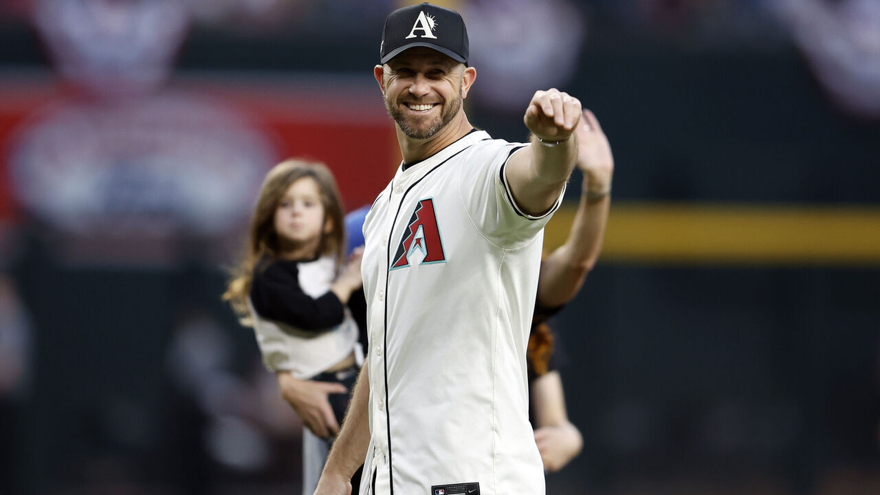 PHOENIX, ARIZONA - MARCH 29: Former Arizona Diamondbacks player Evan Longoria acknowledges the crowd prior to throwing out the first pitch before the game against the Colorado Rockies at Chase Field on March 29, 2024 in Phoenix, Arizona. The Diamondbacks defeated the Rockies 7-3.