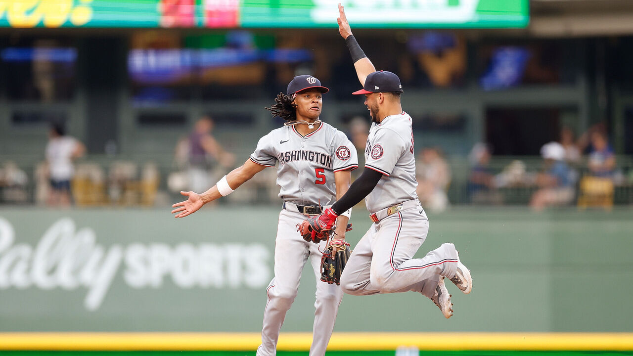 MILWAUKEE, WISCONSIN - JULY 13: CJ Abrams #5 and Luis García Jr. #2 of the Washington Nationals celebrate their 6-5 win over the Milwaukee Brewers at American Family Field on July 13, 2024 in Milwaukee, Wisconsin.