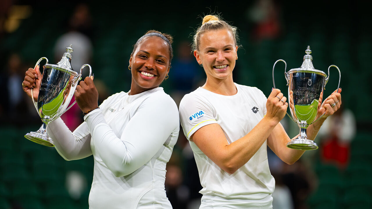 LONDON, ENGLAND - JULY 13: Taylor Townsend of the United States and Katerina Siniakova of the Czech Republic pose with their champions trophies after defeating Erin Routliffe of New Zealand and Gabriela Dabrowski of Canada in the women's doubles final on Day Thirteen of The Championships Wimbledon 2024 at All England Lawn Tennis and Croquet Club on July 13, 2024 in London, England