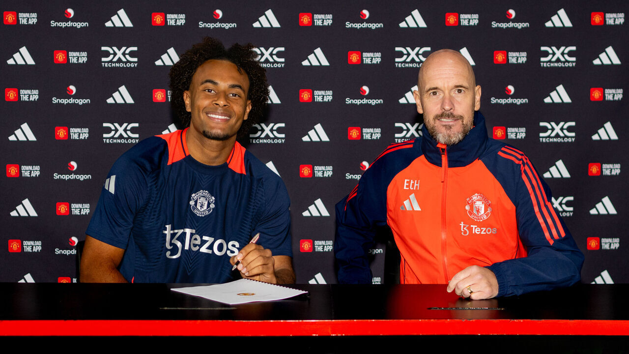 MANCHESTER, ENGLAND - JULY 14: (EXCLUSIVE COVERAGE) Joshua Zirkzee of Manchester United poses with Manager Erik ten Hag after signing for the club at Carrington Training Ground on July 14, 2024 in Manchester, England.