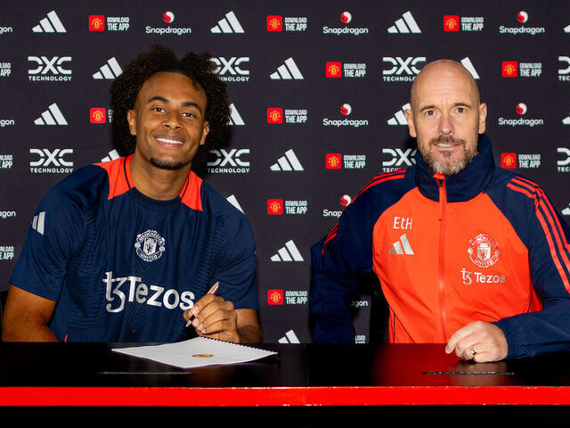 MANCHESTER, ENGLAND - JULY 14: (EXCLUSIVE COVERAGE) Joshua Zirkzee of Manchester United poses with Manager Erik ten Hag after signing for the club at Carrington Training Ground on July 14, 2024 in Manchester, England.