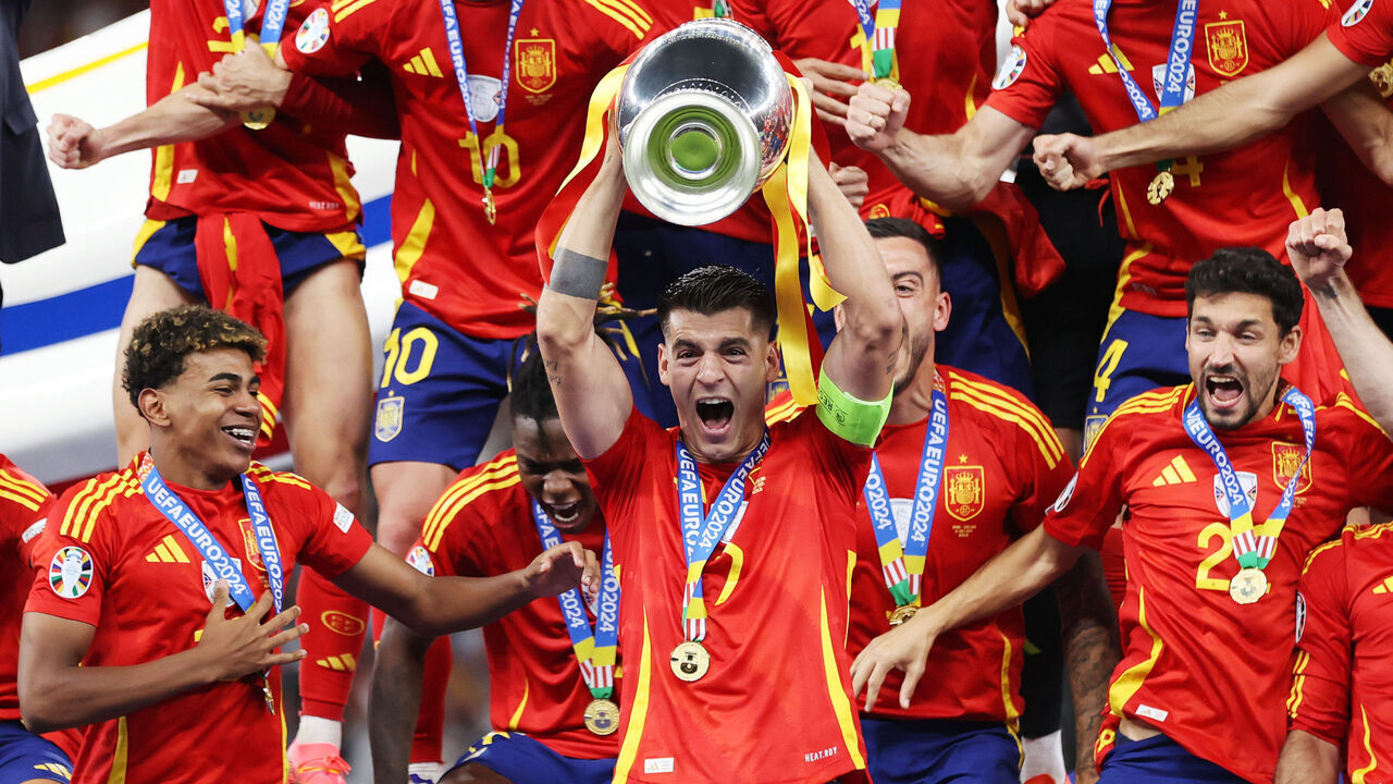 BERLIN, GERMANY - JULY 14: Alvaro Morata of Spain lifts the UEFA Euro 2024 Henri Delaunay Trophy after his team's victory during the UEFA EURO 2024 final match between Spain and England at Olympiastadion on July 14, 2024 in Berlin, Germany.