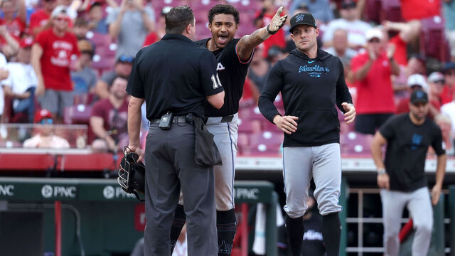 CINCINNATI, OHIO - JULY 13: Dane Myers #54 of the Miami Marlins argues with home plate umpire Derek Thomas #106 after being thrown out of the game during the eighth inning of the game against the Cincinnati Reds at Great American Ball Park on July 13, 2024 in Cincinnati, Ohio. Cincinnati defeated Miami 10-6.