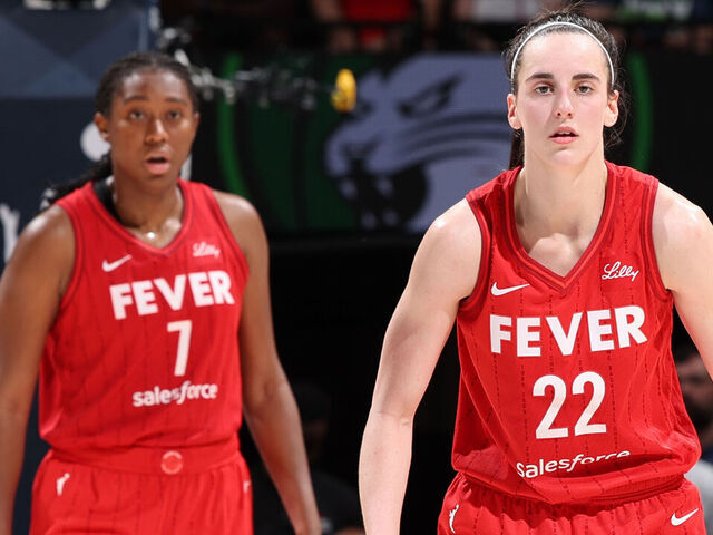 MINNEAPOLIS, MN - JULY 14: Aliyah Boston #7 and Caitlin Clark #22 of the Indiana Fever look on during the game against the Minnesota Lynx on July 14, 2024 at Target Center in Minneapolis, Minnesota. Mandatory Copyright Notice: Copyright 2024 NBAE