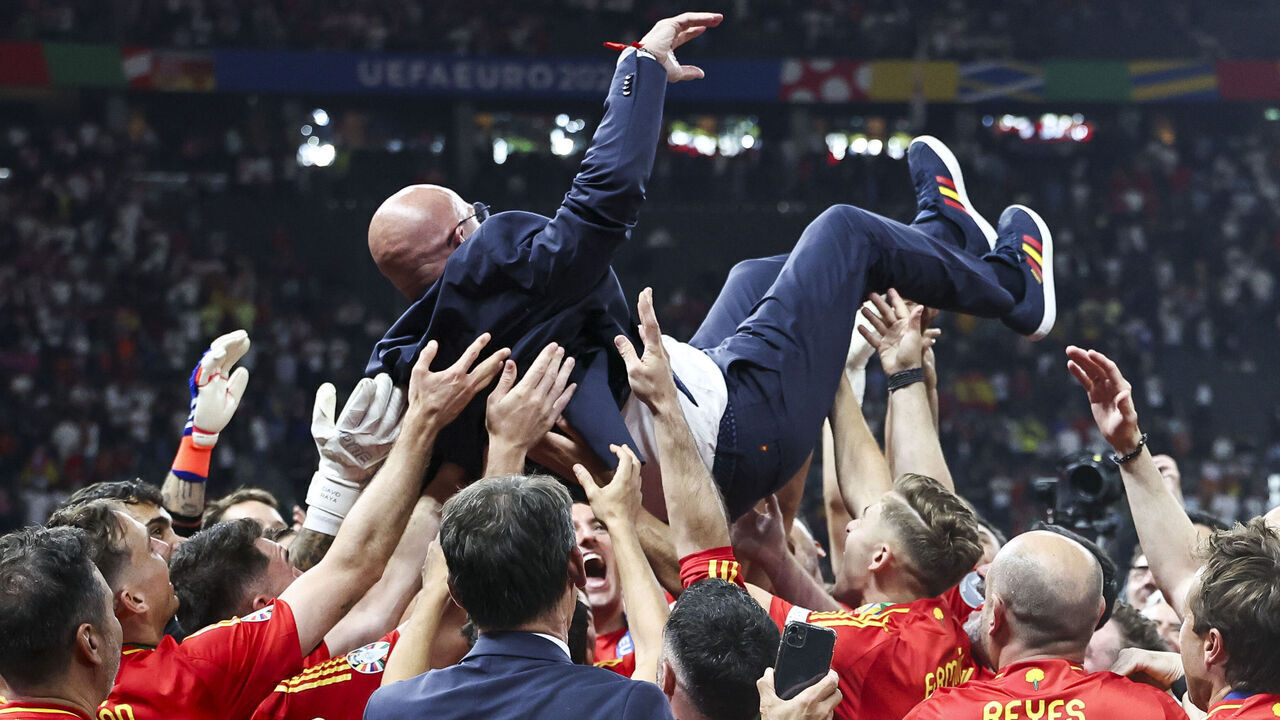 BERLIN, GERMANY - JULY 14: The Spain celebrate lift Spain Head Coach Luis de la Fuente in the air in celebration after winning the UEFA EURO 2024 final match between Spain and England at Olympiastadion on July 14, 2024 in Berlin, Germany.