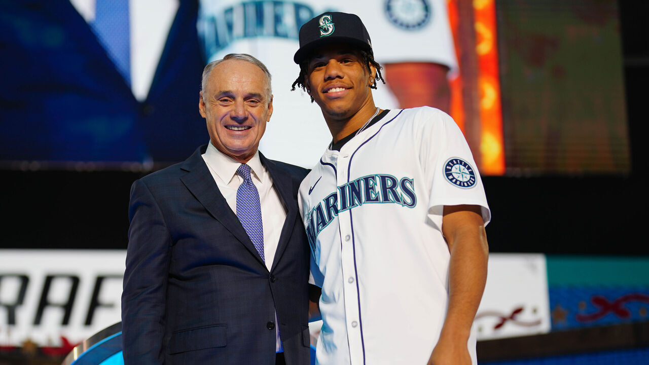 FORT WORTH, TX - JULY 14: Jurrangelo Cijntje poses for a photo with Major League Baseball commissioner Robert D. Manfred Jr. after being drafted by the Seattle Mariners with the 15th pick of the first round during the 2024 MLB Draft presented by Nike at Cowtown Coliseum on Sunday, July 14, 2024 in Fort Worth, Texas.