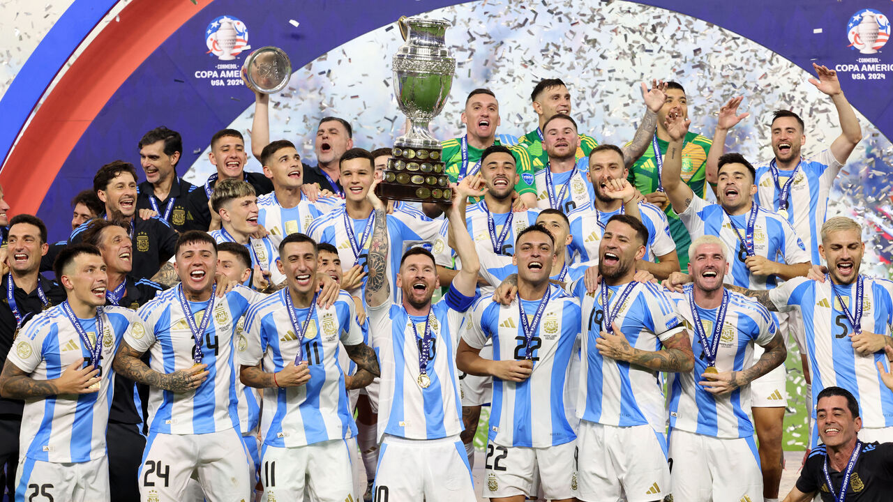 Argentina's forward #10 Lionel Messi lifts up the trophy as he celebrates winning the Conmebol 2024 Copa America tournament final football match between Argentina and Colombia at the Hard Rock Stadium, in Miami, Florida on July 14, 2024.