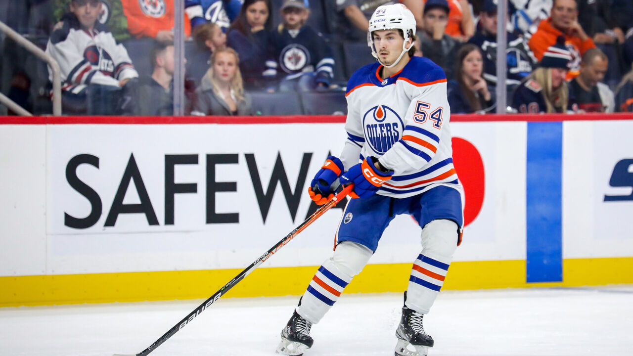 WINNIPEG, CANADA - OCTOBER 1: Xavier Bourgault #54 of the Edmonton Oilers keeps an eye on the play during third period pre-season action against the Winnipeg Jets at the Canada Life Centre on October 1, 2022 in Winnipeg, Manitoba, Canada. The Oilers defeated the Jets 3-2 in the shootout.