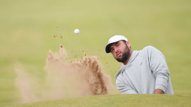 TROON, SCOTLAND - JULY 14: Scottie Scheffler of the United States plays a shot from a bunker during a practice round prior to The 152nd Open championship at Royal Troon on July 14, 2024 in Troon, Scotland.