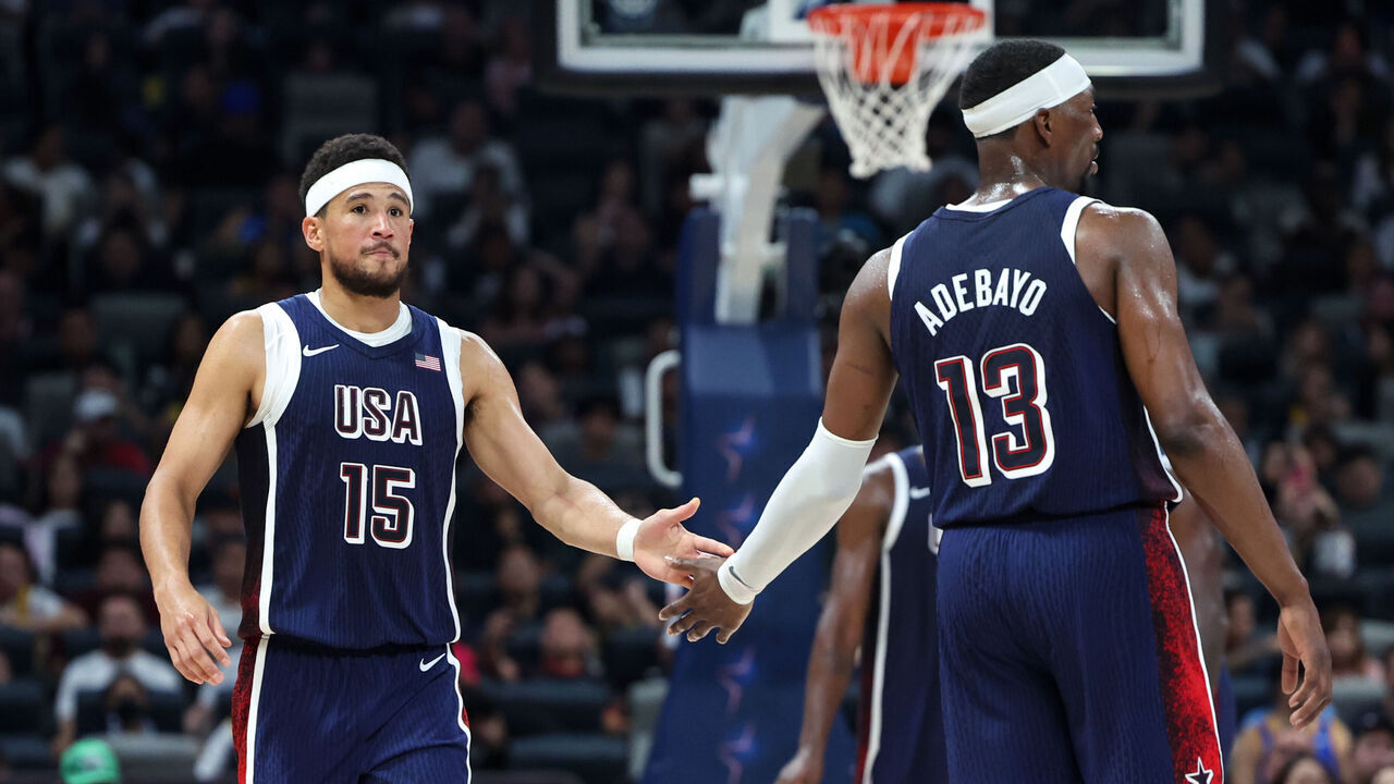ABU DHABI, UAE - JULY 15: Devin Booker #15 and Bam Adebayo #13 of Team USA high five during the game against the Australian Basketball Men's Team during the 2024 USA Basketball Showcase on July 15, 2024 in Abu Dhabi, The United Arab Emirates at Etihad Arena. NOTE TO USER: User expressly acknowledges and agrees that, by downloading and/or using this Photograph, user is consenting to the terms and conditions of the Getty Images License Agreement. Mandatory Copyright Notice: Copyright 2024 NBAE