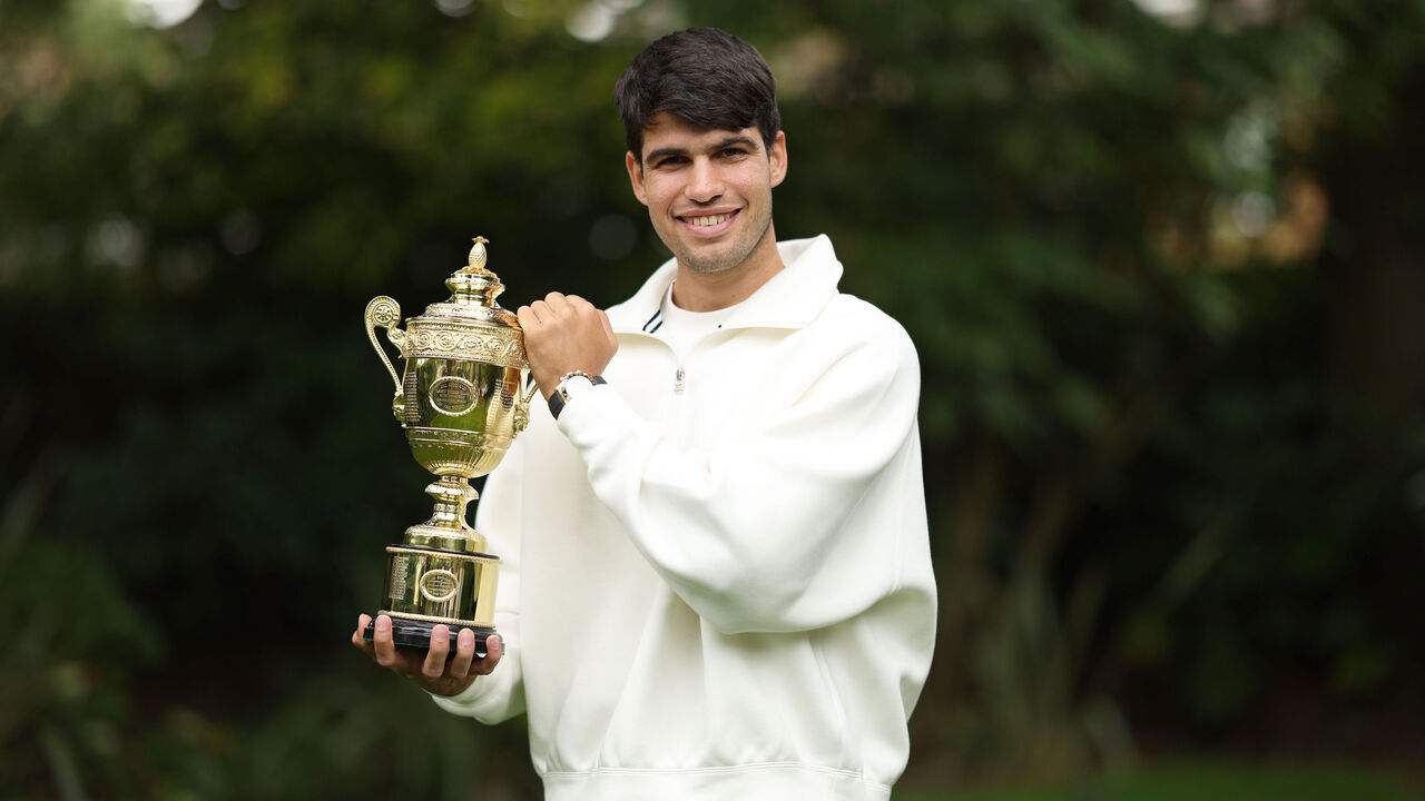 LONDON, ENGLAND - JULY 15: Wimbledon 2024 Gentlemen's Singles champion Carlos Alcaraz of Spain poses for a photograph with the Gentlemen's Singles Trophy during a photo shoot following his victory in the Wimbledon Championships Gentlemen's Singles final match against Novak Djokovic of Serbia on July 15, 2024 in London, England.