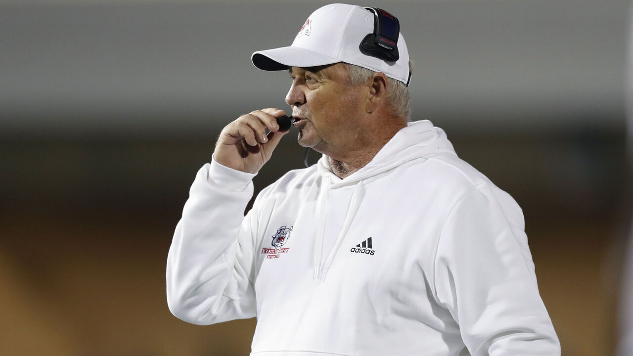 LOGAN, UT - OCTOBER 13: Head coach Jeff Tedford of the Fresno State Bulldogs talks into his headset during the second half of their game against the Utah State Aggies at Maverik Stadium on October 13, 2023 in Logan, Utah.