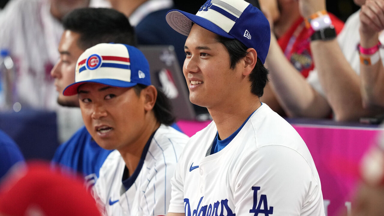 ARLINGTON, TEXAS - JULY 15: Shota Imanaga #18 of the Chicago Cubs and Shohei Ohtani #17 of the Los Angeles Dodgers look on during the T-Mobile Home Run Derby at Globe Life Field on July 15, 2024 in Arlington, Texas.
