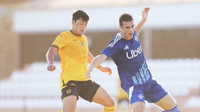 MARBELLA, SPAIN - JULY 15: Hee chan Hwang of Wolverhampton Wanderers (L) battles for possession during a training game between Wolverhampton Wanderers and Como 1907 on July 15, 2024 in Marbella, Spain.