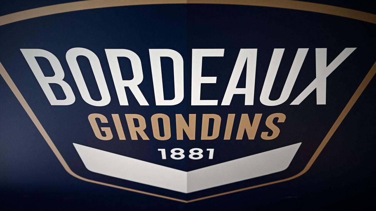 The logo of the Girondins de Bordeaux football clubis pictured during a press conference at the club's training ground in Le Haillan, near Bordeaux, on May 6, 2021. - King Street, the American investment fund that owns the Girondins de Bordeaux, announced on April 23, 2021, that it no longer wanted to support and finance the club. Bordeaux is looking at several options including two potential buyers, according to the Bordeaux city hall, and a group of "local" entrepreneurs will present a "democratic" plan to take over the Girondins de Bordeaux by also proposing to supporters and fans to become shareholders through a digital finance platform, the project leader told AFP.