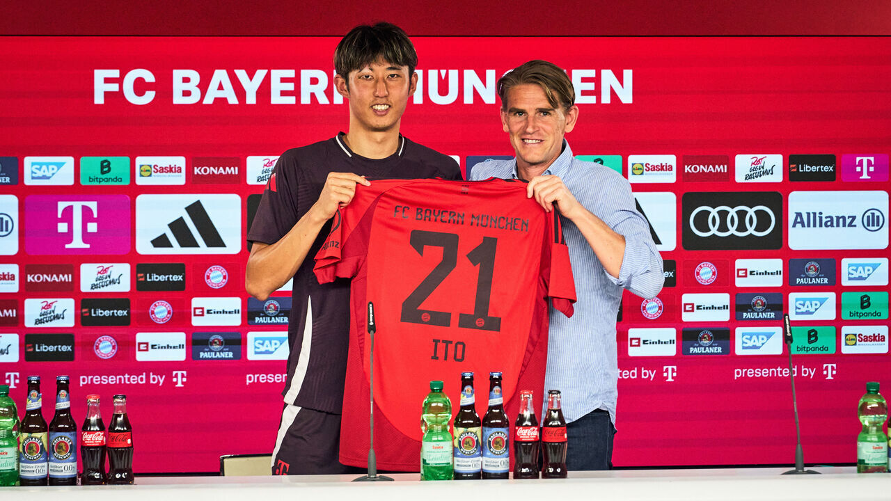 MUNICH, GERMANY - JULY 16: Hiroki Ito of FC Bayern München and Christoph Freund, sporting director of FC Bayern München, pose during a press conference as part of Ito's unveiling on July 16, 2024 in Munich, Germany. The 25 year old Japan signed a contract until June 2028.