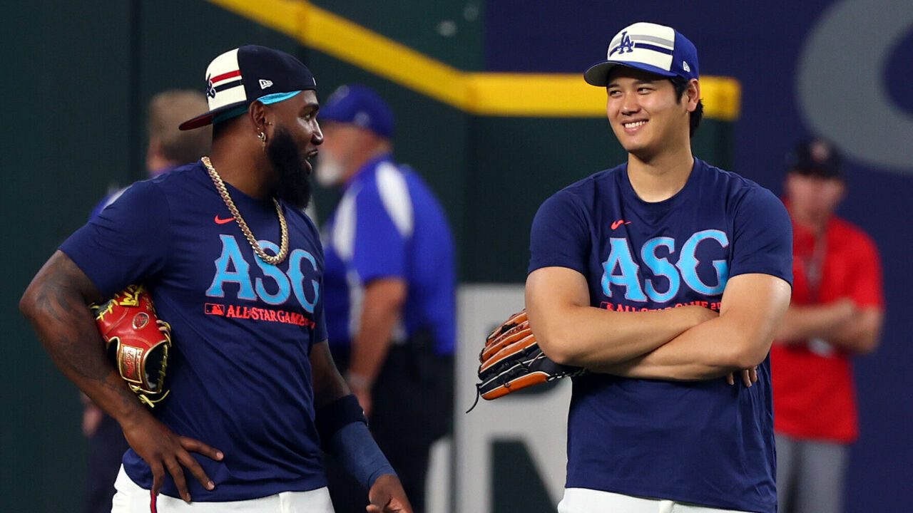 ARLINGTON, TEXAS - JULY 15: Marcell Ozuna #20 of the Atlanta Braves speaks with Shohei Ohtani #17 of the Los Angeles Dodgers during Gatorade All-Star Workout Day at Globe Life Field on July 15, 2024 in Arlington, Texas.