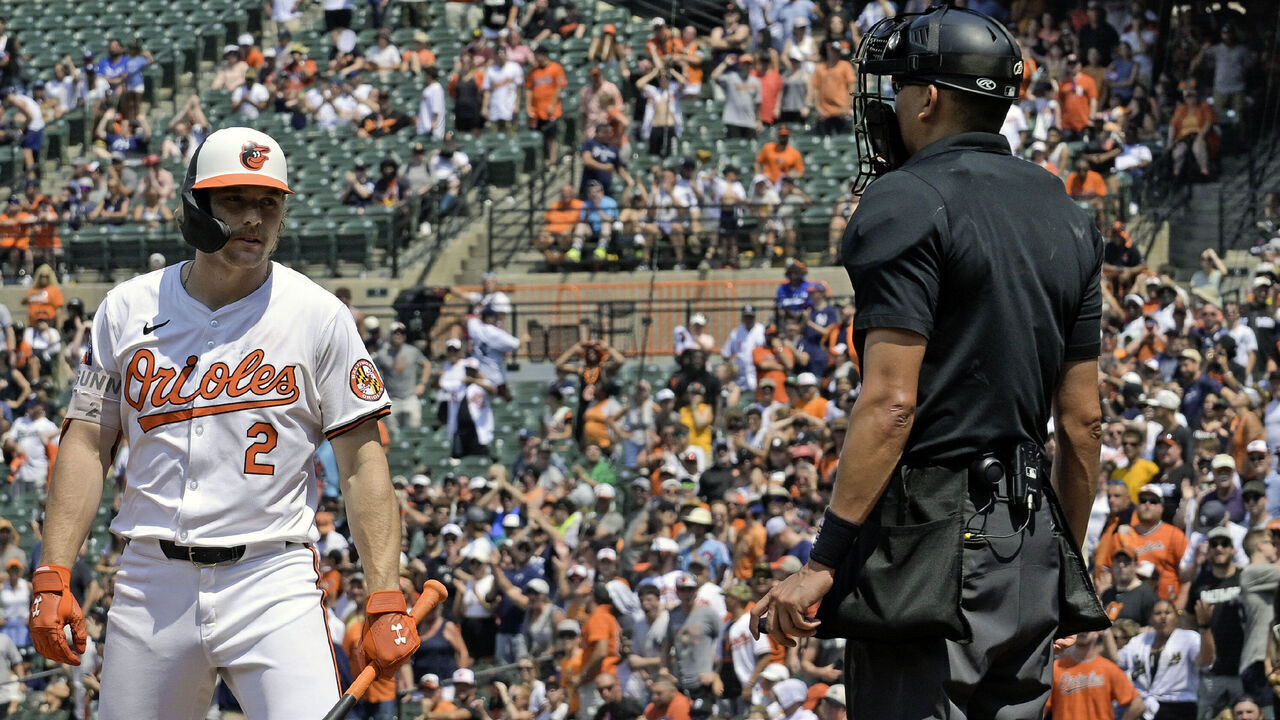 BALTIMORE, MD - JULY 14: Baltimore Orioles shortstop Gunnar Henderson (2) questions a strike call from home plate umpire Emil Jimenez (82) during the New York Yankees versus the Baltimore Orioles on July 14, 2024 at Oriole Park at Camden Yards in Baltimore, MD.