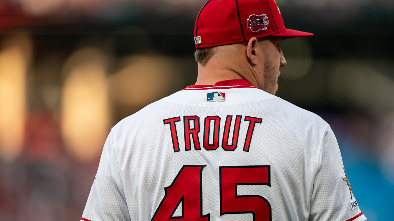 CLEVELAND, OH - JULY 09: American League All-Star Mike Trout #27 of the Los Angeles Angels (wearing #45 in honor of Tyler Skaggs) looks on during the 90th MLB All-Star Game on July 9, 2019 at Progressive Field in Cleveland, Ohio.