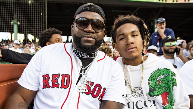 BOSTON, MA - JUNE 20: Former designated hitter David Ortiz of the Boston Red Sox poses for a photograph with his son DAngelo Ortiz after presenting a Boston Red Sox Hall of Fame plaque to former left fielder Manny Ramirez during a pre-game ceremony before a game against the Detroit Tigers on June 20, 2022 at Fenway Park in Boston, Massachusetts.