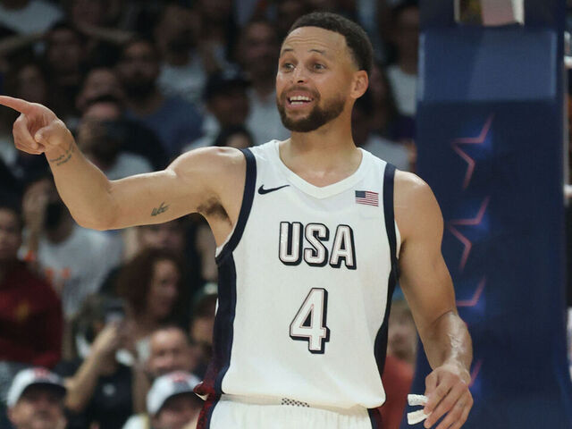 ABU DHABI, UAE - JULY 17: Stephen Curry #4 of Team USA looks on during the game against the Serbian Men's National Team during the 2024 USA Basketball Showcase on July 17, 2024 in Abu Dhabi, The United Arab Emirates at Etihad Arena. NOTE TO USER: User expressly acknowledges and agrees that, by downloading and/or using this Photograph, user is consenting to the terms and conditions of the Getty Images License Agreement. Mandatory Copyright Notice: Copyright 2024 NBAE