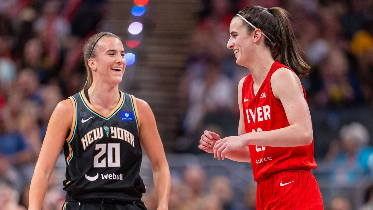 INDIANAPOLIS, INDIANA - JULY 6: Caitlin Clark #22 of the Indiana Fever and Sabrina Ionescu #20 of the New York Liberty talk during the game at Gainbridge Fieldhouse on July 6, 2024 in Indianapolis, Indiana.