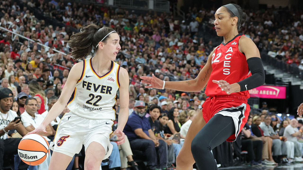 LAS VEGAS, NEVADA - JULY 02: Caitlin Clark #22 of the Indiana Fever is guarded by A'ja Wilson #22 of the Las Vegas Aces in the first quarter of their game at T-Mobile Arena on July 02, 2024 in Las Vegas, Nevada.