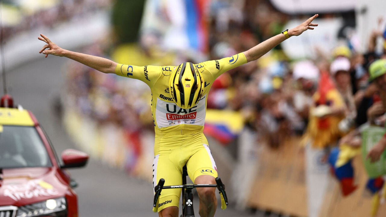 UAE Team Emirates team's Slovenian rider Tadej Pogacar celebrates as he crosses the finish line to win the 19th stage of the 111th edition of the Tour de France cycling race, 144,6 km between Embrun and Isola 2000, in the French Alps, on July 19, 2024.