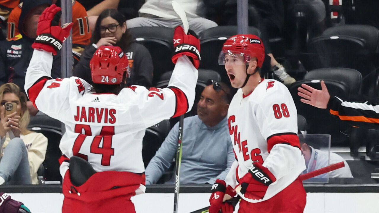 ANAHEIM, CA OCTOBER 15: Martin Necas #88 and Seth Jarvis #24 of the Carolina Hurricanes celebrate a goal during the game against the Anaheim Ducks on October 15, 2023 at Honda Center in Anaheim, California.