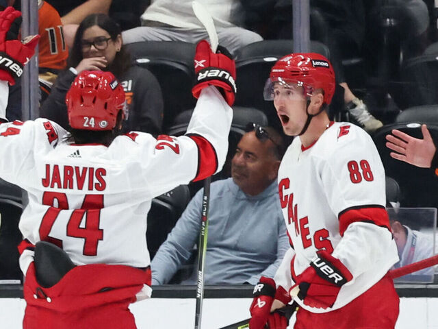 ANAHEIM, CA OCTOBER 15: Martin Necas #88 and Seth Jarvis #24 of the Carolina Hurricanes celebrate a goal during the game against the Anaheim Ducks on October 15, 2023 at Honda Center in Anaheim, California.