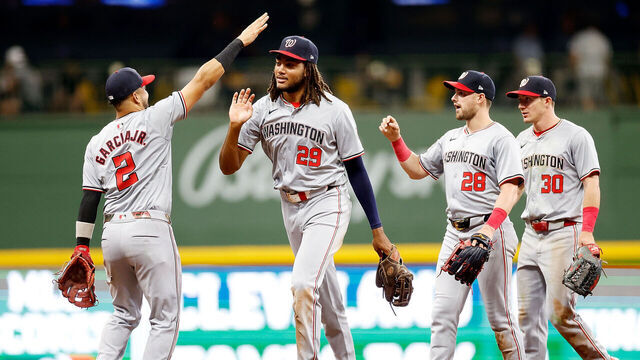 MILWAUKEE, WISCONSIN - JULY 12: Luis García Jr. #2, James Wood #29, Lane Thomas #28 and Jacob Young #30 of the Washington Nationals celebrate a 5-2 win over the Milwaukee Brewers at American Family Field on July 12, 2024 in Milwaukee, Wisconsin.