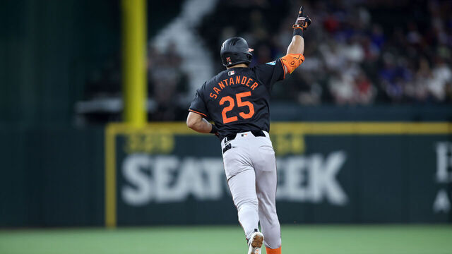 ARLINGTON, TEXAS - JULY 19: Anthony Santander #25 of the Baltimore Orioles rounds the bases after hitting a two-run home run in the fifth inning against the Texas Rangers at Globe Life Field on July 19, 2024 in Arlington, Texas.