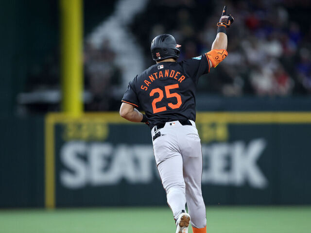ARLINGTON, TEXAS - JULY 19: Anthony Santander #25 of the Baltimore Orioles rounds the bases after hitting a two-run home run in the fifth inning against the Texas Rangers at Globe Life Field on July 19, 2024 in Arlington, Texas.