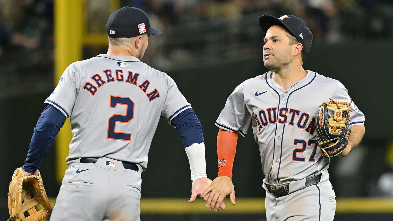 SEATTLE, WASHINGTON - JULY 19: Alex Bregman #2 and Jose Altuve #27 of the Houston Astros shakes hands after the game against the Seattle Mariners at T-Mobile Park on July 19, 2024 in Seattle, Washington. The Houston Astros won 3-0.