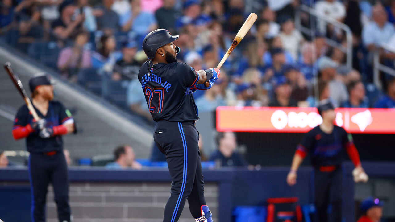 TORONTO, ON - JULY 19: Vladimir Guerrero Jr. #27 of the Toronto Blue Jays hits a two-run home run in the sixth inning during a game against the Detroit Tigers at Rogers Centre on July 19, 2024 in Toronto, Ontario, Canada.