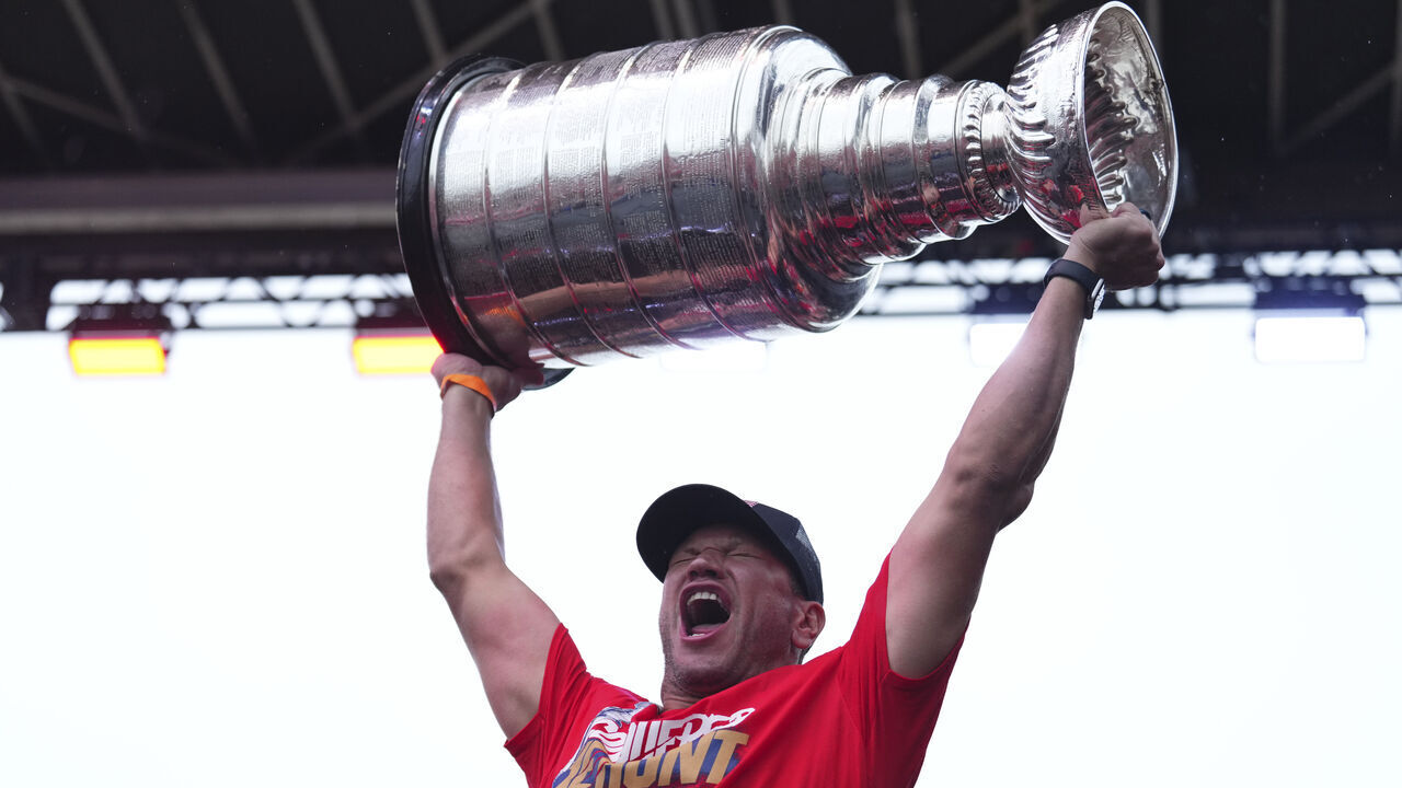 FORT LAUDERDALE, FLORIDA - JUNE 30: Kyle Okposo #8 of the Florida Panthers hoists the Stanley Cup during the celebration for the Florida Panthers win of the Stanley Cup on June 30, 2024 in Fort Lauderdale, Florida.