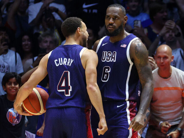 LONDON, ENGLAND - JULY 20: Stephen Curry #4 and LeBron James #6 of Team USA celebrate during the game against South Sudan as part of the 2024 USA Basketball Showcase on July 20, 2024 in London, England at O2 Arena. NOTE TO USER: User expressly acknowledges and agrees that, by downloading and/or using this photograph, user is consenting to the terms and conditions of the Getty Images License Agreement. Mandatory Copyright Notice: Copyright 2024 NBAE