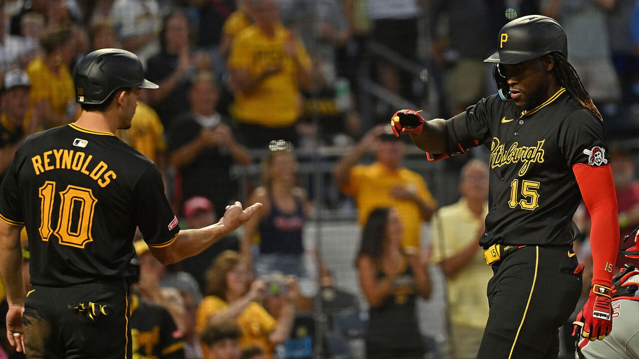 PITTSBURGH, PENNSYLVANIA - JULY 20: Oneil Cruz #15 of the Pittsburgh Pirates celebrates with Bryan Reynolds #10 after hitting a two run home run in the eighth inning during the game against the Philadelphia Phillies at PNC Park on July 20, 2024 in Pittsburgh, Pennsylvania.