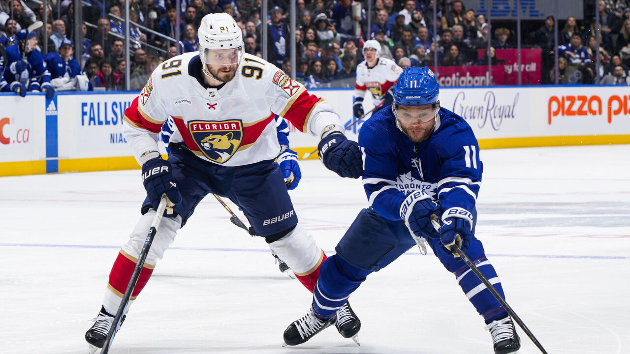 TORONTO, ON - APRIL 1: Max Domi #11 of the Toronto Maple Leafs battles against Oliver Ekman-Larsson #91 of the Florida Panthers during the third period at Scotiabank Arena on April 1, 2024 in Toronto, Ontario, Canada.