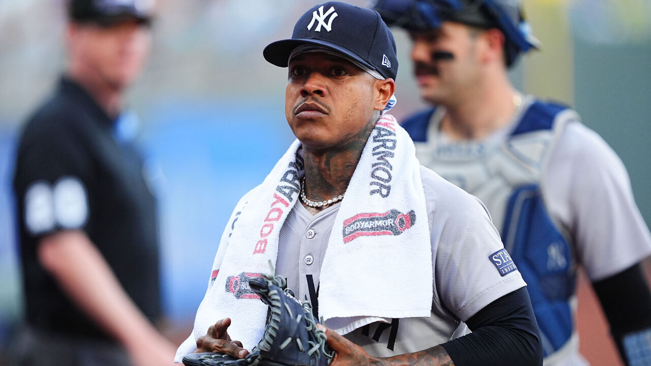 KANSAS CITY, MISSOURI - JUNE 11: Marcus Stroman #0 of the New York Yankees heads to the dugout before taking on the Kansas City Royals at Kauffman Stadium on June 11, 2024 in Kansas City, Missouri.