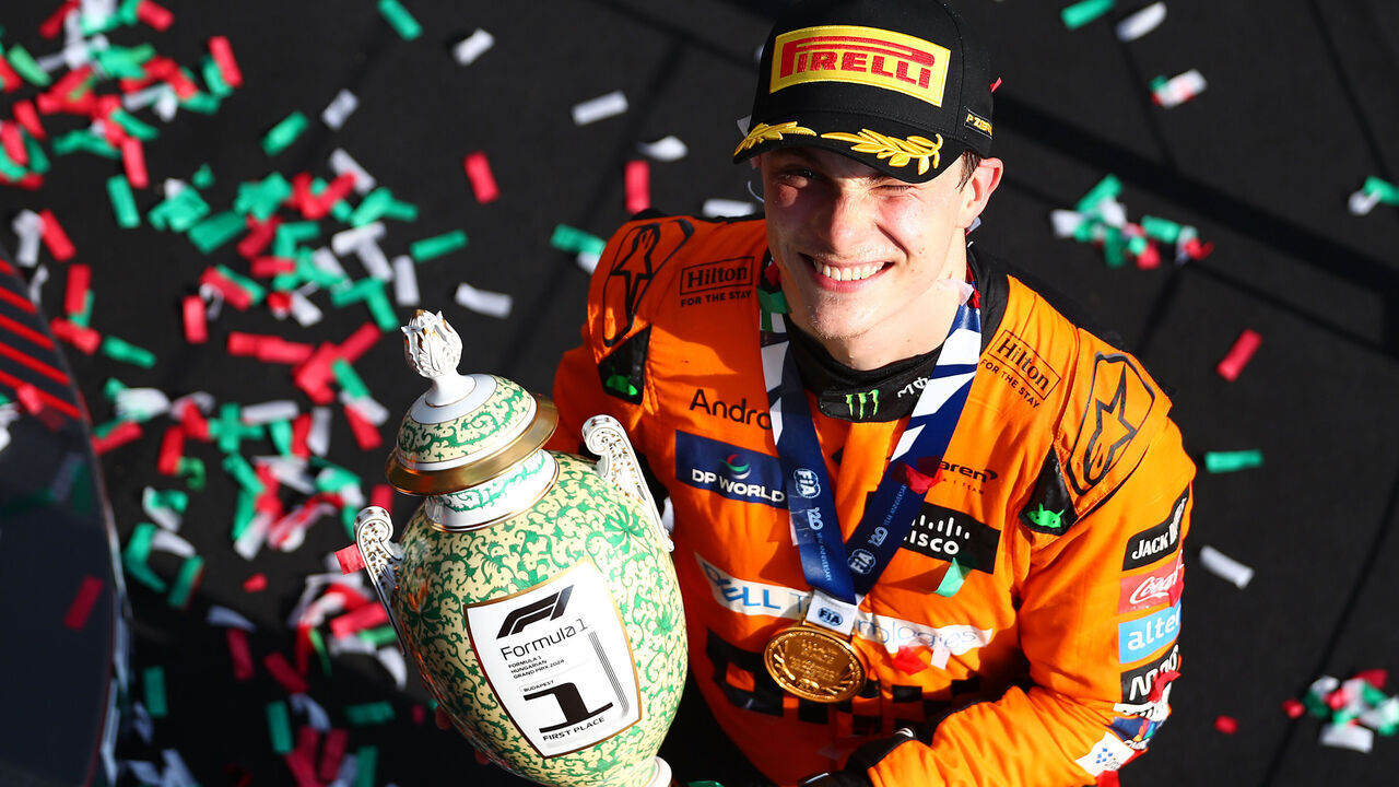 BUDAPEST, HUNGARY - JULY 21: Race winner Oscar Piastri of Australia and McLaren celebrates his maiden race win on the podium during the F1 Grand Prix of Hungary at Hungaroring on July 21, 2024 in Budapest, Hungary.