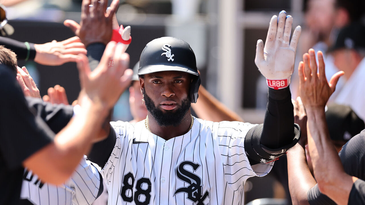 CHICAGO, ILLINOIS - JULY 10: Luis Robert Jr. #88 of the Chicago White Sox high fives teammates after hitting a two-run home run off Bailey Ober #17 of the Minnesota Twins (not pictured) during the sixth inning at Guaranteed Rate Field on July 10, 2024 in Chicago, Illinois.