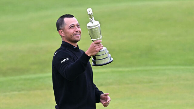 US golfer Xander Schauffele poses with the Claret Jug, the trophy for the Champion golfer of the year after winning the 152nd British Open Golf Championship at Royal Troon on the south west coast of Scotland on July 21, 2024.
